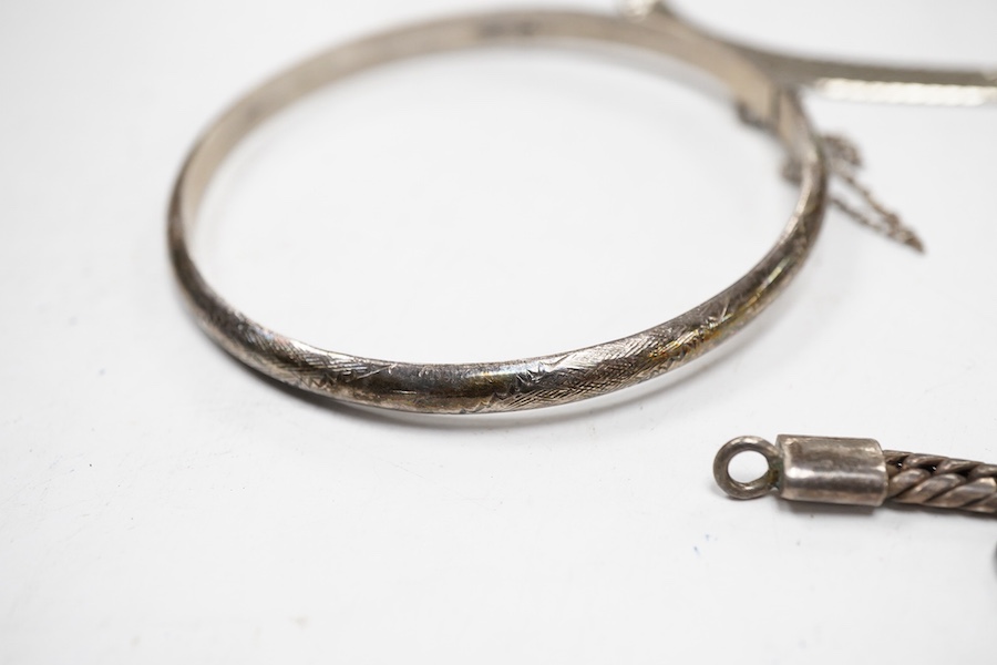 Two white metal bangles, one inscribed 'sterling silver' the other '925', together with a silver Uno A Erre chain, four other 925 chains, one curb link and four other white metal chains, longest approx. 69cm.